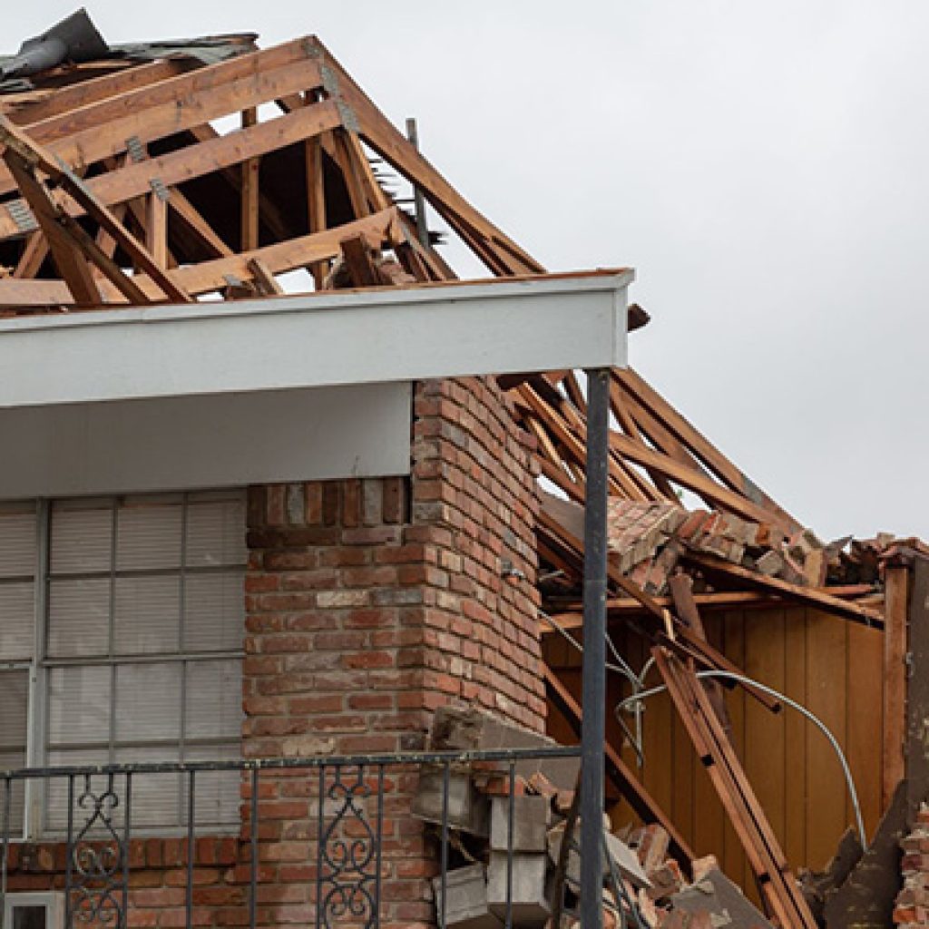 Claims Adjuster Assessing Property Damage For Claim Settlement
