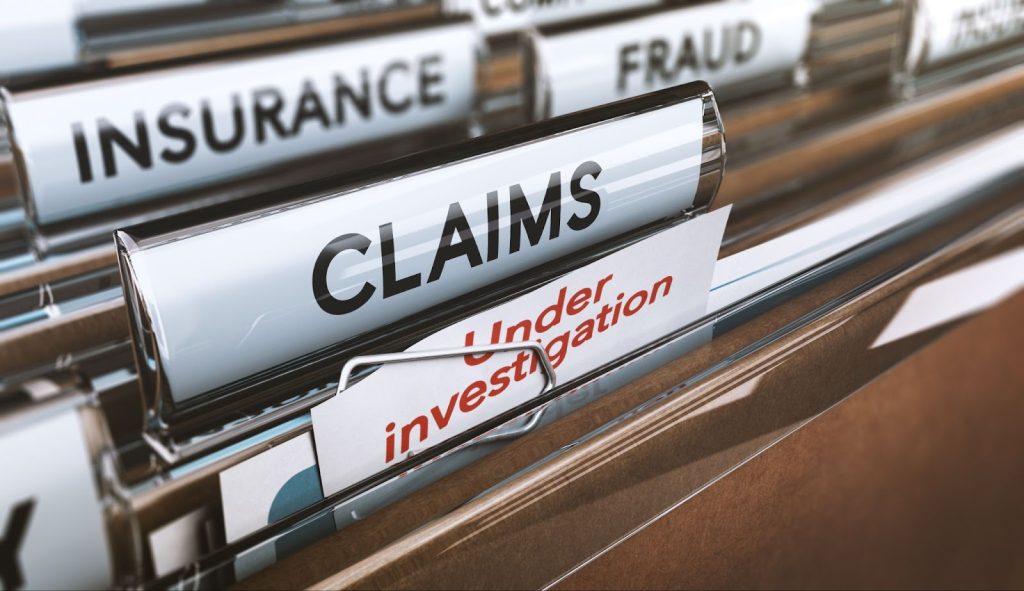Insurance claims being processed by a claims adjuster for property damage and claim settlement
