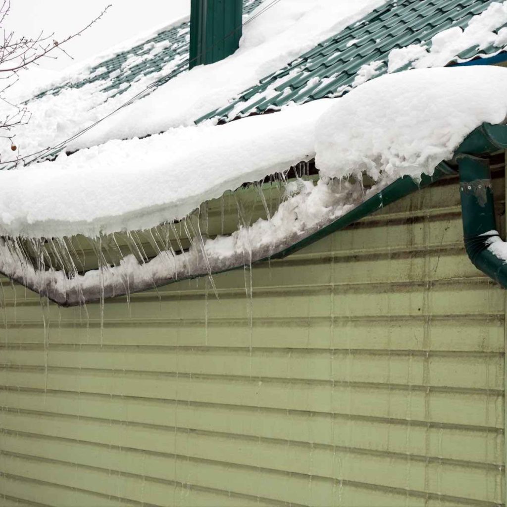 Roof covered in icicles, risk of water damage, house water damage, public adjuster.