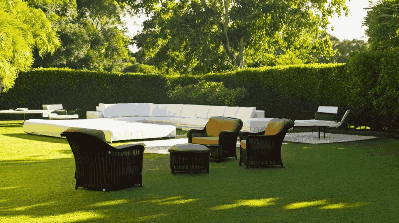 A serene lawn featuring a white couch and chairs, ideal for relaxation, associated with Hudson Douglas Public Adjusters.